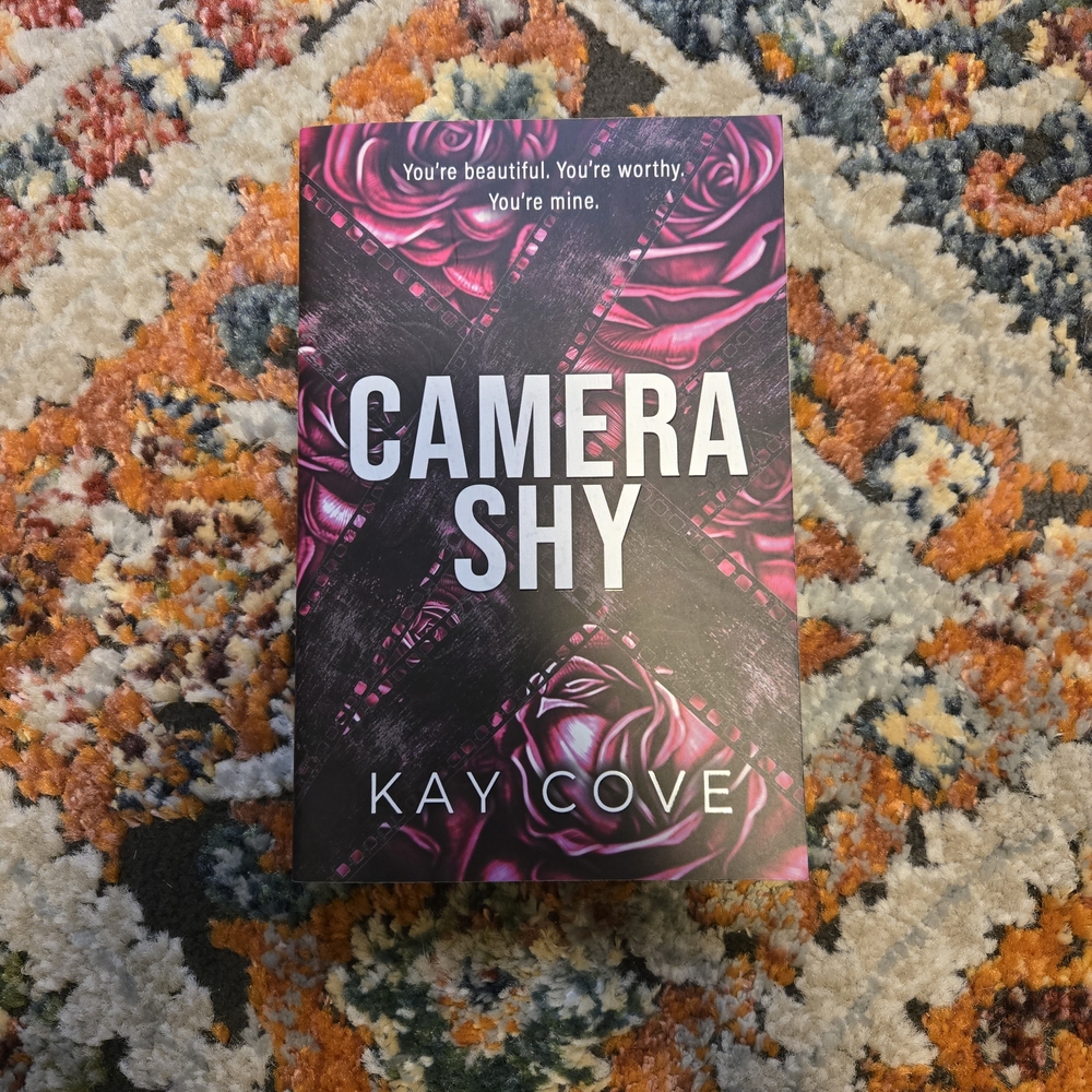 Camera Shy by - Contemporary Novel with Pink Rose Design
